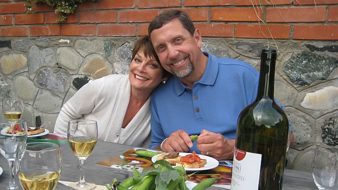couple eating and drinking white wine