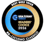 Scenic view of Italy bike tour with cyclists riding through picturesque landscape, highlighting Ciclismo Classico's top bike tour experiences in Italy for cycling enthusiasts.