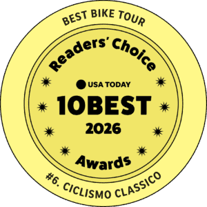 Award badge for best bike tour company in Italy by Ciclismo Classico, highlighting top bike tours in Italy and recognition in 2026.