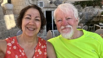 Smiling couple enjoying a bike tour in Italy, highlighting Ciclismo Classico's top bike tours and companies in Italy for cycling enthusiasts.