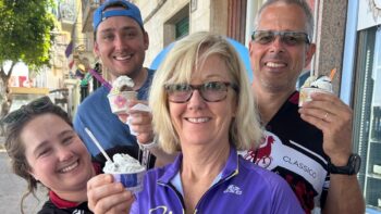 Happy group enjoying ice cream after a bike tour in Italy, showcasing Ciclismo Classico's popular bike tours and travel experiences in Italy.